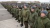 Mobilized Russian citizens line up at an assembly station in Kazan on October 23 before departing for the front lines in Ukraine.