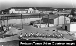Inmates walking through a courtyard of the Sopronkohida penitentiary and prison in western Hungary in 1985.