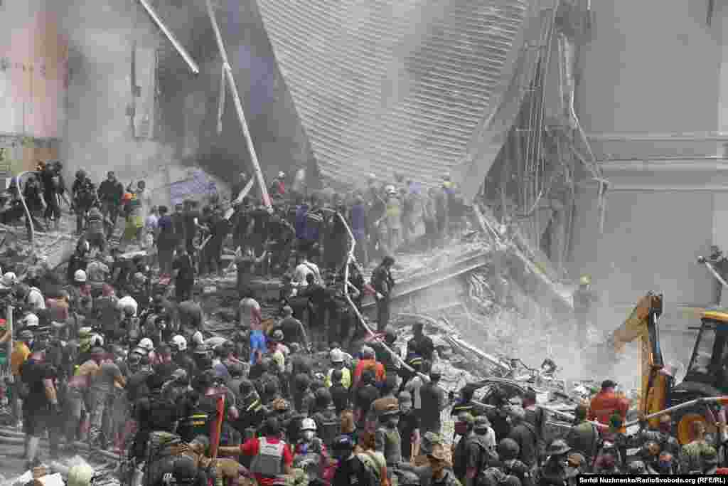 Volunteers, doctors, and rescue workers search for survivors at the Okhmatdyt Children's Hospital in Kyiv following a deadly Russian missile attack on July 8. Ukrainian authorities said at least 24 people were killed and dozens injured in a "massive" Russian daytime missile attack on the capital and other cities. 