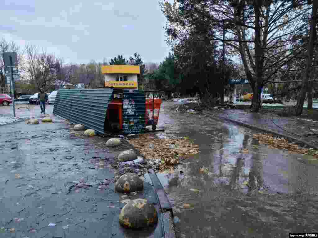 A resident walks amid the aftermath of flooding in Crimea's capital, Simferopol, on November 27.
