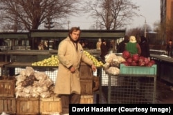 A worker at a market in Iasi in January 1988
