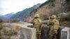 Pakistani soldiers stand guard at a checkpoint in the disputed Kashmir region. (file photo)