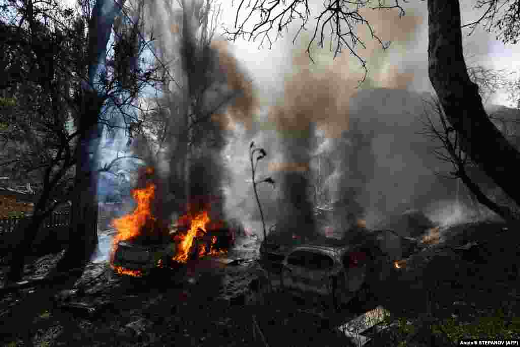 The attack also damaged several residential buildings in Kyiv, leaving behind smoldering cars and courtyards. 