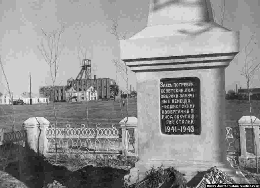 A memorial alongside an unidentified mine shaft. The inscription says, "Here lie Soviet people cruelly tortured to death by the German-Fascist fiends during the occupation of Stalino, 1941-1943." Millions of Ukrainians died at the hands of occupying Nazi-led forces during World War II, which came shortly after Soviet Ukraine's populace was decimated by the Kremlin-engineered famine known as the Holodomor. 