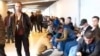 Tajiks and other Central Asians wait inside Vnukovo airport in Moscow as they look to enter Russia.