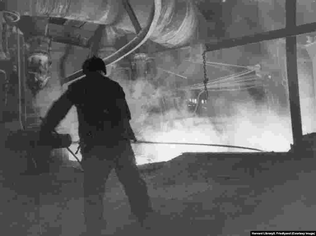Molten iron flows in the Stalino iron and steelworks after its restoration following World War II. 