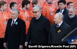 Mirziyoev, Toqaev, and Putin arrive at Red Square in Moscow for the Victory Day parade on May 9.