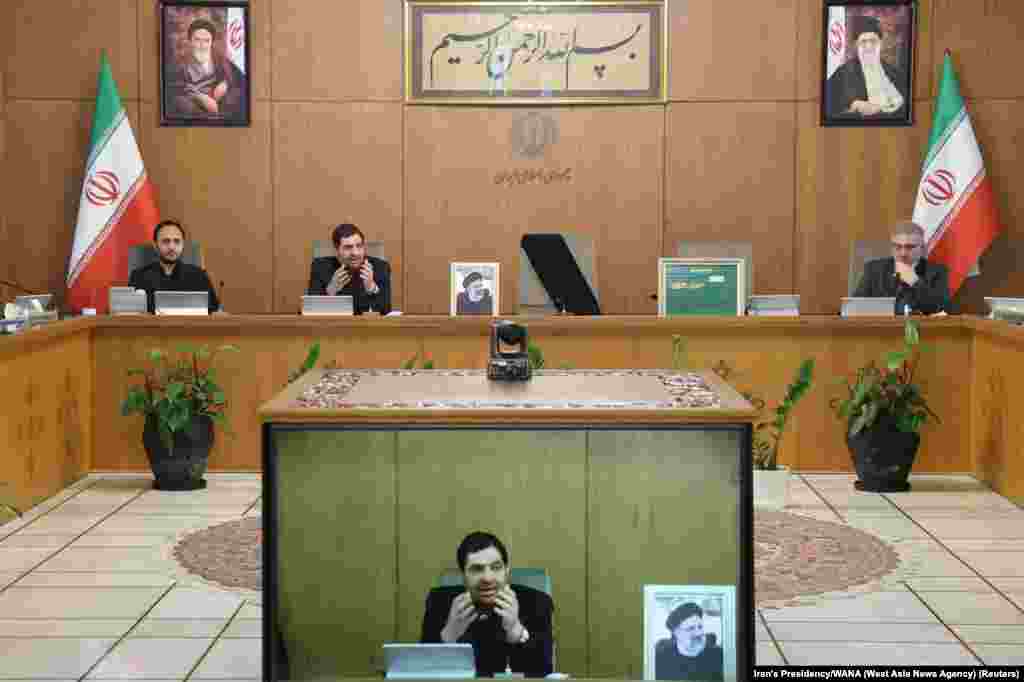 First Vice President Mohammad Mokhber speaks during a government cabinet meeting in Tehran on May 20 next to an empty chair, draped in a black fabric, where Raisi normally sat. Khamenei has named Mokhber interim president. 