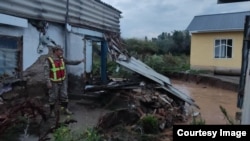 Floods and mudslides caused by heavy rains in Kyrgyzstan's Issyk-Kul resort area on August 18 damaged hundreds of houses.