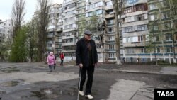 People are seen during an operation to evacuate some 3,000 people from 17 apartment buildings in Belgorod, Russia, over an explosive hazard on April 23. 