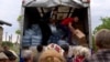 GRAB Ukrainians Brave Russian Attacks To Get Supplies To Flood-Stricken Villages