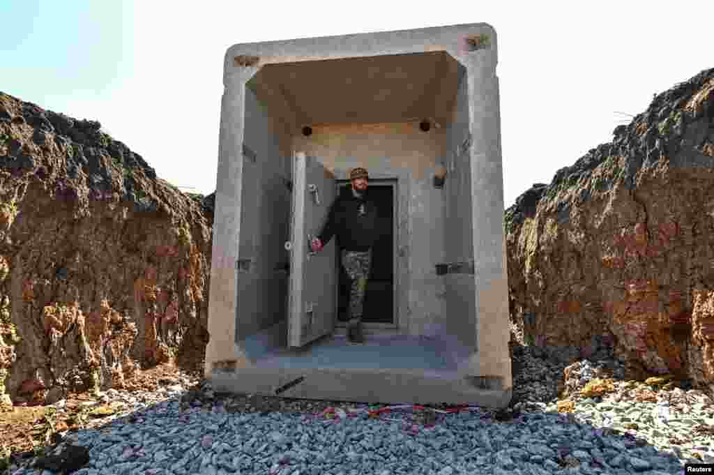 A concrete dugout built as part of Ukraine's new system of defensive fortifications is shown to the media on March 11 near an undisclosed location near Zaporizhzhya. President Volodymyr Zelenskiy claimed that Russian advances had been "halted" as his country embarks on building nearly 1,000 kilometers of defensive fortifications.