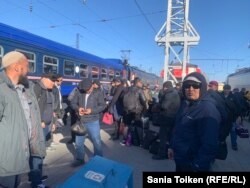 Scores of oil workers arrived in the Kazakh capital, Astana, from Zhanaozen on April 10.