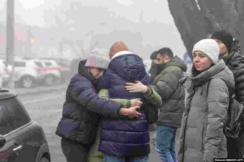 Odesa residents comfort one another. With rescue workers still working the scenes at several locations around the country, the death toll is expected to rise.