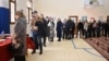 Azerbaijani leader Ilham Aliyev (center) and his family arrive in Nagorno-Karabakh to vote in a presidential election on February 7.