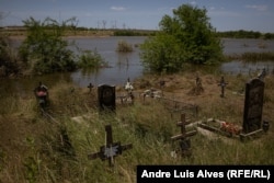 The partly flooded cemetery in Odradokamyanka in the Kherson region.