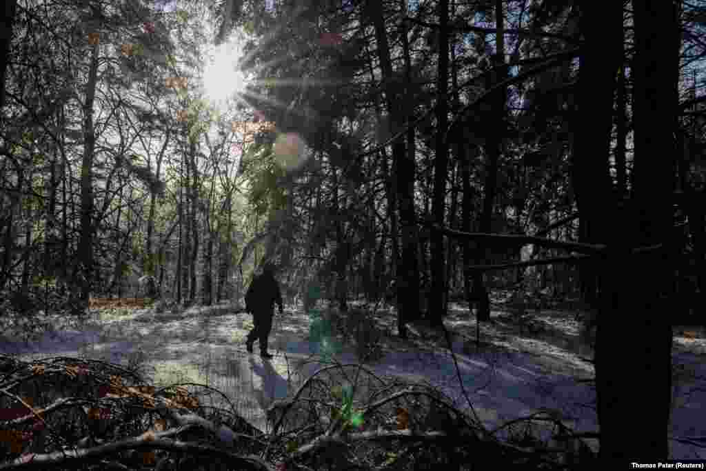 A Ukrainian soldier patrols the forest. &quot;There&#39;s a problem with ammunition, especially post-Soviet [shells] - that&#39;s 122-millimeter, 152-mlillimeter [shells]. And today these problems exist across the entire front line,&quot; Tarnavskiy said in an interview, adding that the shortage of artillery shells was a &quot;very big problem&quot; and the drop in foreign military aid was having an impact on the&nbsp;battlefield. &nbsp;