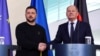 German Chancellor Olaf Scholz and Ukraine's President Volodymyr Zelenskiy shake hands at a press conference in Berlin on February 16.