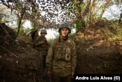 Yuriy (right) and Viktor man trenches less than 200 meters from Russian positions.