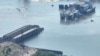 An aerial photograph of the destroyed Kakhovka dam in Ukraine in June. 