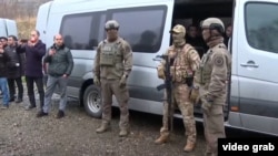 Armenia and Azerbaijan exchange prisoners on December 13.