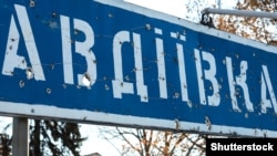 A bullet-riddled road sign for Avdiyivka in Ukraine's war-torn Donetsk region