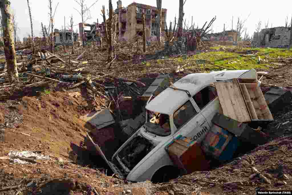 A car and ammunition boxes in a crater in Bakhmut on April 10. The eastern city has been under sustained Russian shelling since May 2022, while all-out infantry assaults have been ongoing since December. 