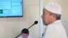 Kazakh opposition activist Ermek Qonyshbai in a courtroom in Shymkent on August 19. 