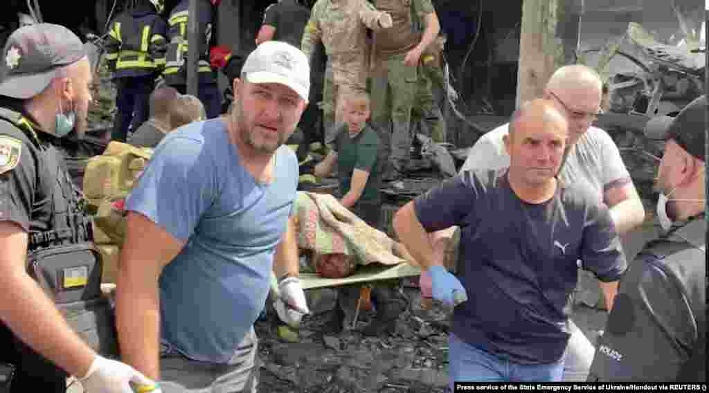 A body is recovered from the rubble by rescuers. The attack came as European Union officials convened in The Hague to discuss war crimes in Ukraine.