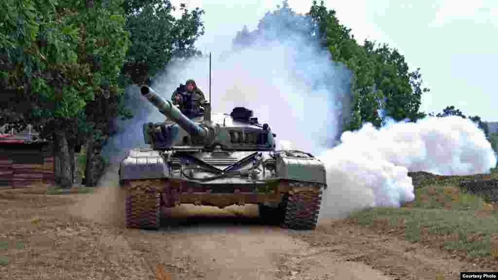 A Serbian tank takes part in drills near Kosovo on August 31. Earlier that day, Serbia’s Defense Ministry announced that military drills were being held alongside the border with Kosovo to "ensure peace and security on the administrative line."