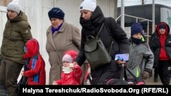 Біженці з України на українсько-польському кордоні. 2022