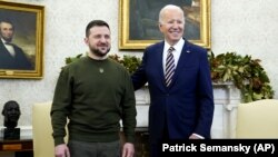 Ukrainian President Volodymyr Zelenskiy speaks to reporters as he meets with U.S. President Joe Biden in the White House in December.