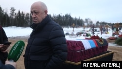 Wagner founder Yevgeny Prigozhin attends the funeral of one of his fighters in December.