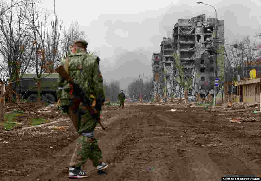 Separatist troops pass the Azovstal plant on April 12. 