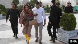 "Head scarf or a head smack!" Iranian enforcers warn women about their clothing and hair during a crackdown in Tehran in 2012.