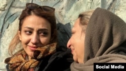 Maryam Karimbeigi (left), the sister of Mustafa Karimbeigi, a 26-year-old protester who was shot and killed by Iranian security forces in 2009, pictured with her mother, Shahnaz Akmali. 