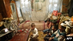 Gathering round the TV set in eastern Uzbekistan