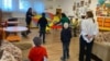 Younger children take part in a game to develop motor skills at an orphanage in Romania that has been repurposed to house Ukrainian kids with disabilities. 