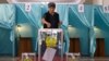 A voter weighs in on a nationwide referendum held in Kazakhstan in 2022.