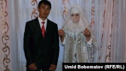 Newly married Anvar and Nargiz after their traditional wedding. The Tajik government is wary of a revival of Muslim customs, fearing the rise of radical Islam and the return of young people who went to fight in Syria.
