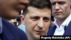 Ukrainian President Volodymyr Zelenskiy arrives at a polling station in Kyiv on July 21.