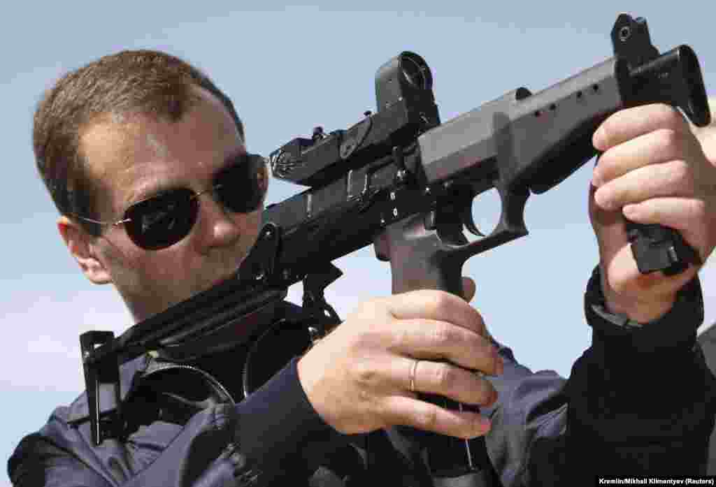 In another photo opportunity, Medvedev takes aim as he visits the Federal Security Service (FSB) Special Task Center in Russia's southern region of Daghestan on June 9, 2009.