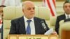 Tillerson In Iraq After Baghdad Dismisses Call For Iran-Backed Militias To 'Go Home'