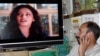 Afghan Minister Backs TV Head Scarves