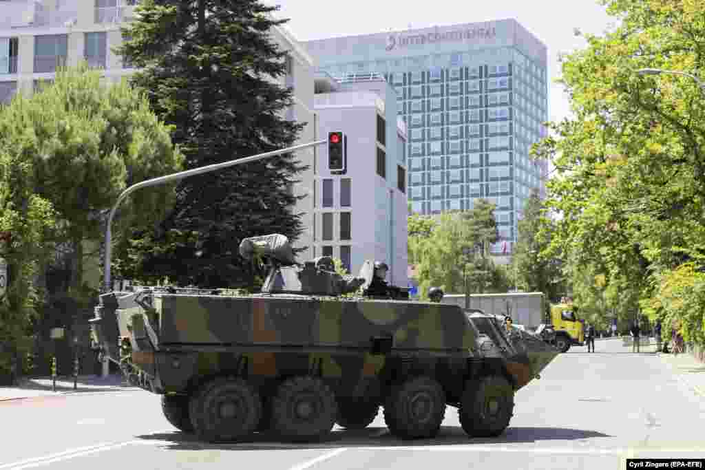 An armored vehicle stands in front of Geneva's InterContinental hotel, where Joe Biden is staying, on June 15. 