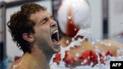 Russia's Denis Tarasov reacts to winning the men's 50-meter freestyle final S8 category during the London 2012 Paralympic Games.