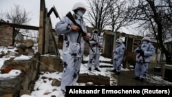 Russia-backed separatists are seen at a frontline position near the contact line with Ukrainian forces in the village of Zholobok in the eastern Luhansk region on March 23.