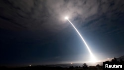 An unarmed Minuteman III intercontinental ballistic missile takes flight during an operational test at Vandenberg Air Force Base, California.