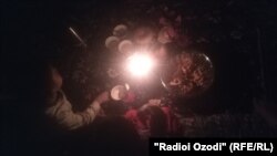 With no electricity at night, Tajiks must make due with batteries.