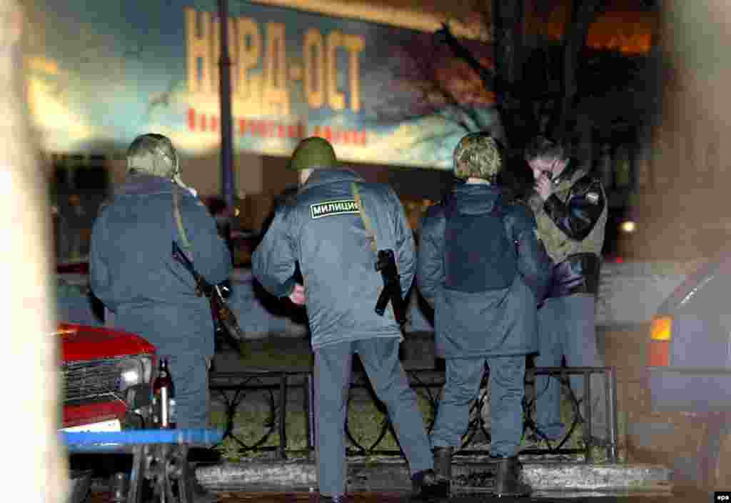 Russian police stand outside the Dubrovka theater in Moscow after Chechen extremists stormed the building and took between 900 and 1,000 people hostage on the evening of October 23, 2002. 